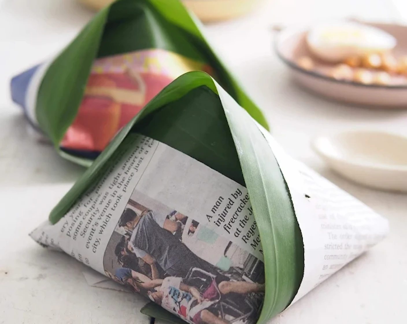 Nasi lemak wrapped with banana leaf and newspaper